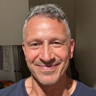 Smiling man in his kitchen